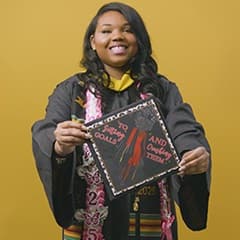 Triniti Adams '25, BS in Public Health grad from SNHU, displaying a decorated graduation cap.