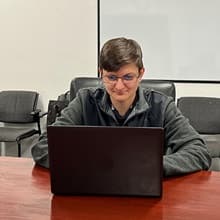 SNHU Student Nicole Staller using her laptop.