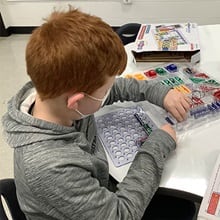 A child using snap circuits in the new STEAM lab at Webster Elementary School.