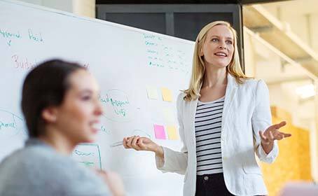 A business woman leading a meeting