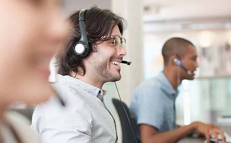 Two men talking on headsets