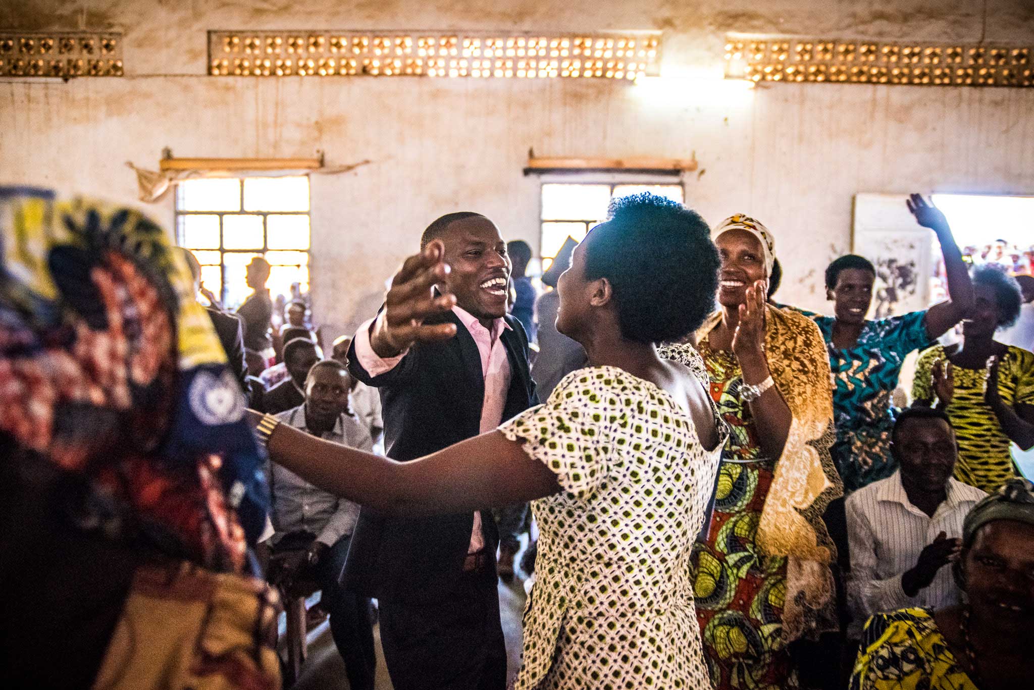 Student Moise Celebrates with a hug - Photographer Alex Buisse