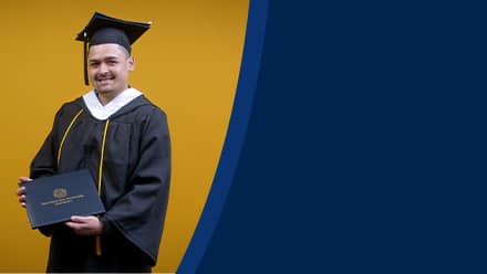 Anthony Fernandez, SNHU graduate with a bachelor's in political science holding his diploma.