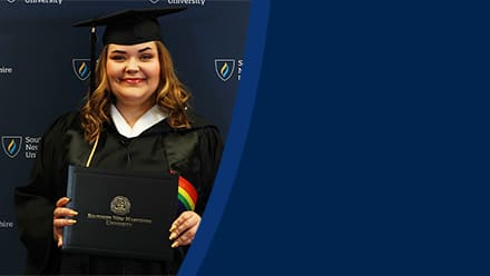 Ashley Smith, a 2024 SNHU graduate who earned her bachelor's in communication wearing her cap and gown in front of a dark blue background.