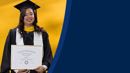 Brendaliz De Los Santos dressed in a graduation cap and gown, holding her SNHU diploma after finishing her master's in marketing.