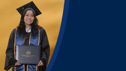 Carlene Estigoy, an SNHU graduate with a bachelor's in psychology, wearing a graduation cap and gown