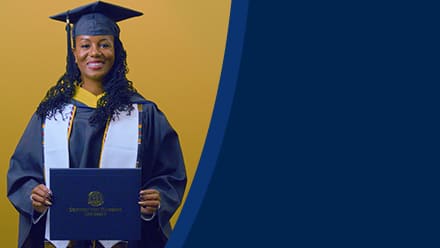 Kyla Johnson-Curtis, a 2025 SNHU grad who earn her bachelor's in operations management with a concentration in logistics and transportation holding her diploma in front of a yellow background.