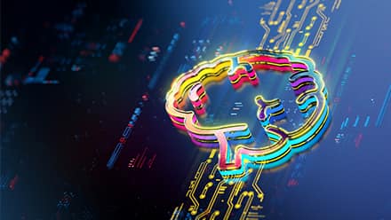 A neon outline of a brain lit up on a computer board to express the learning of AI.