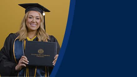 Madison Richards dressed in a graduation cap and gown after earning her bachelor's in marketing with a concentration in digital marketing at SNHU in 2026.