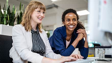 Healthcare professionals discussing how online medical billing and coding courses are worth it