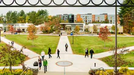 Exterior of SNHU campus with students walking outside