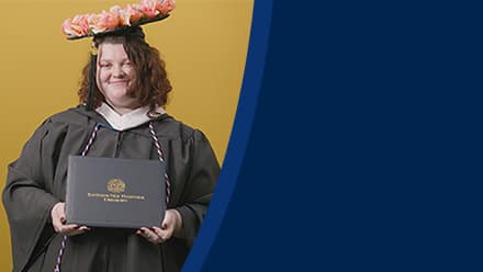 Shelbie Lynne Ayles, a 2025 graduate who earned her bachelor’s in psychology with a minor in sociology from SNHU wearing her cap and gown in front of a yellow background.
