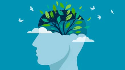 A design of a green tree blossoming inside a head with birds flying to demonstrate the importance of mental health awareness.
