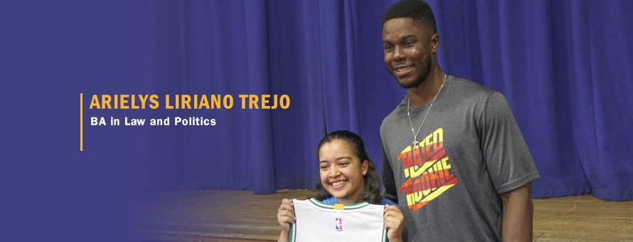 Arielys Liriano Trejo standing with Semi Ojeleye holding a custom Celtics jersey and the text Arielys Liriano Trejo, BA in Law and Politics.