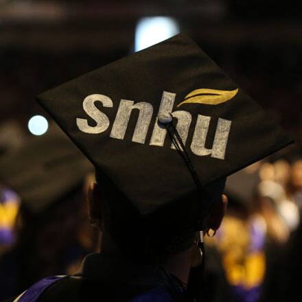 The top of a graduation cap decorated with the SNHU logo.