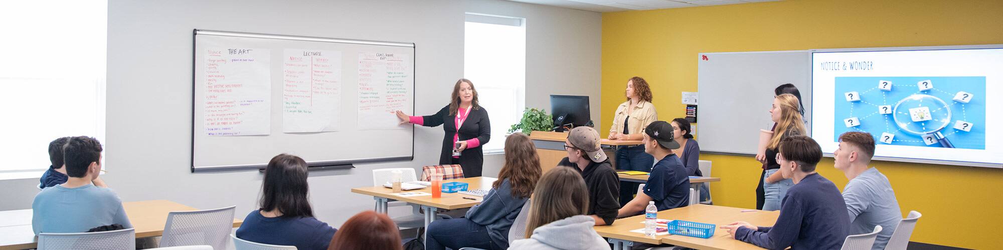 SNHU students in a classroom being led by an instructor