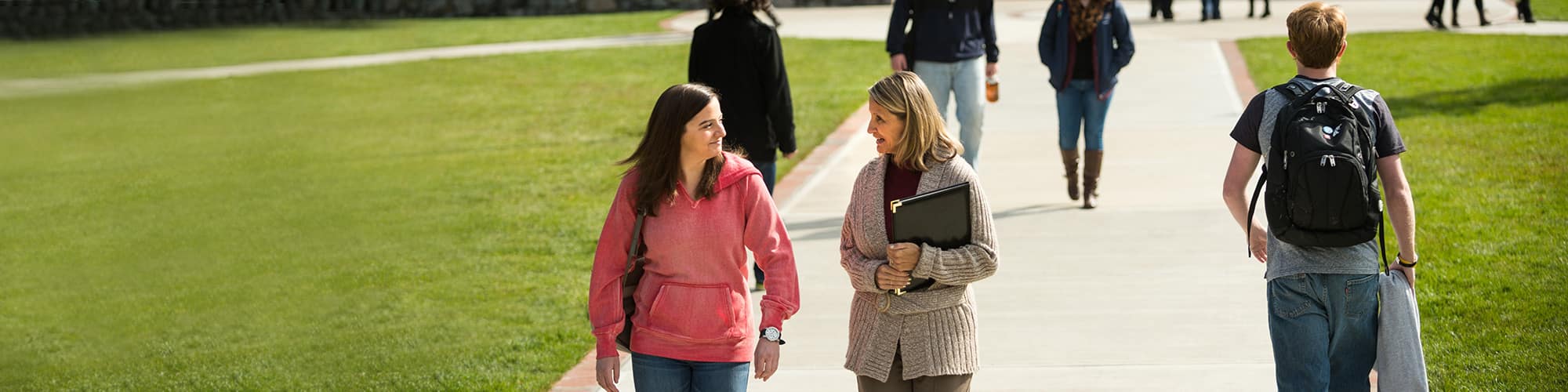 Multiple Students walking around Campus