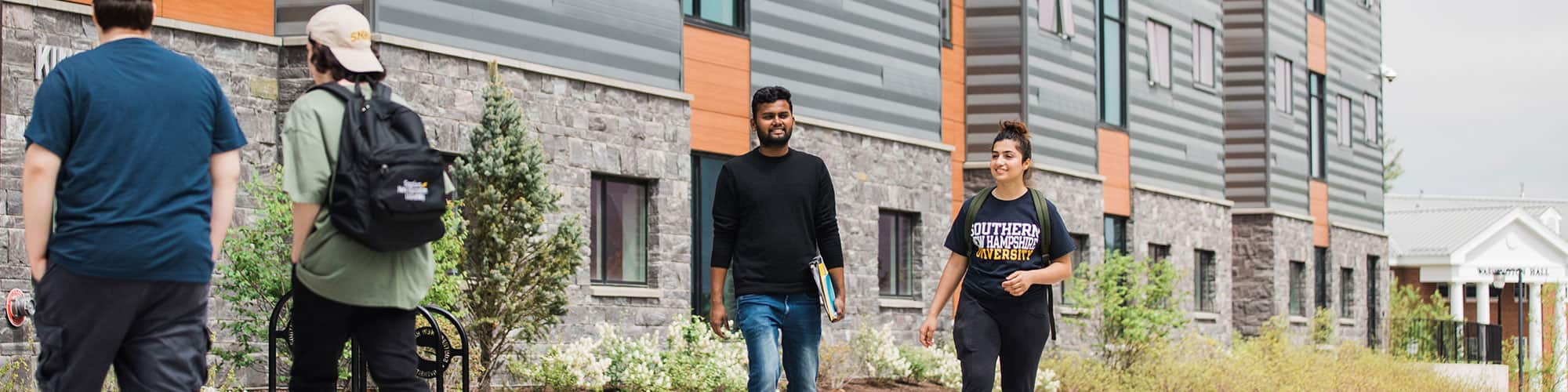 Multiple students walking on Campus