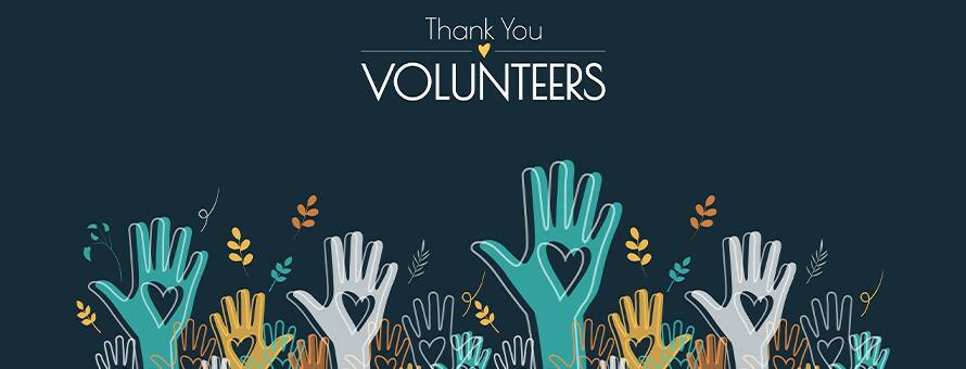Illustration of raised hands with heart symbols and the words “Thank You Volunteers” on a dark blue background.