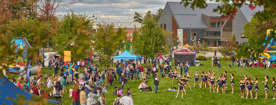 People gathered on Southern New Hampshire University's green space during the 2023 Homecoming Street Fair