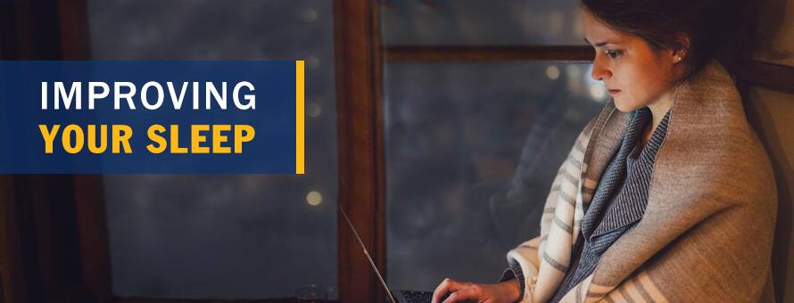A female college student working on her laptop late at night and the text Improving Your Sleep.