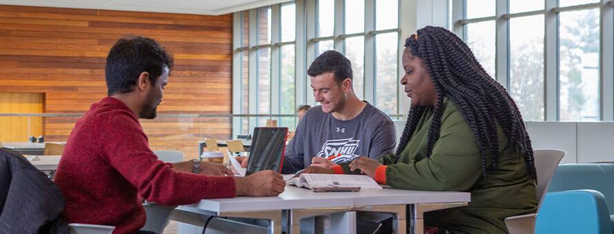 Three high school students learning how to prepare for college.