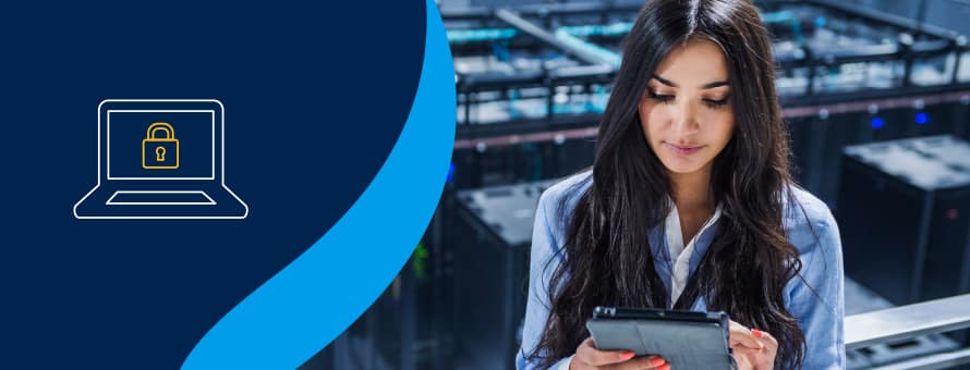 A woman using a tablet to pursue an online cybersecurity degree