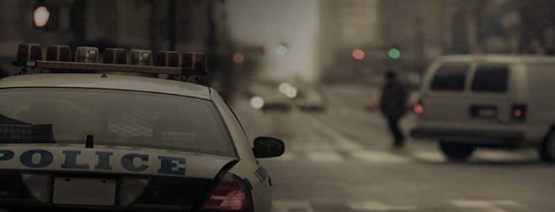 A police car in a busy city street