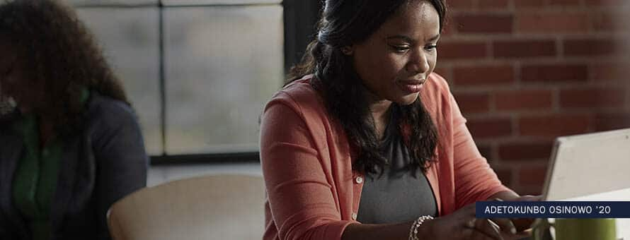 Woman typing on a laptop, with text "Adetokunbo Osinowo '20"