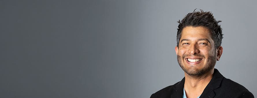 Dr. Enrique Barreiro, the senior associate dean of online business programs at SNHU, wearing a dark sports coat.