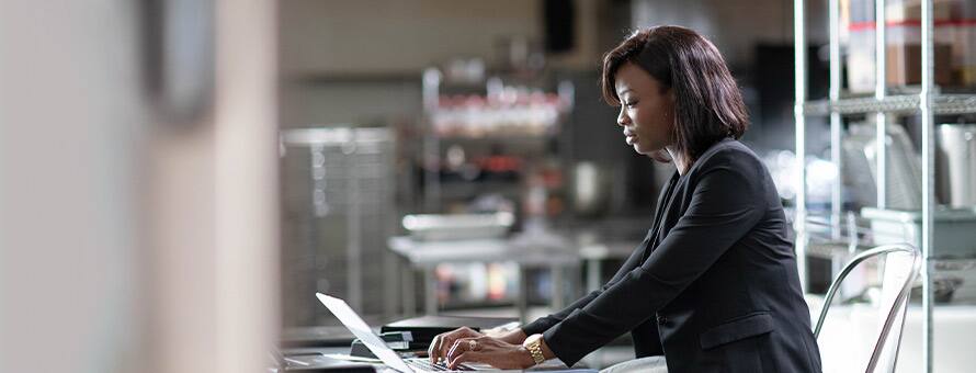 A woman working on her laptop