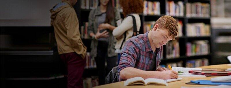 Sociology student studying in a library