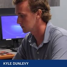 Kyle Dunlevy working on a computer and the text 'Kyle Dunlevy'
