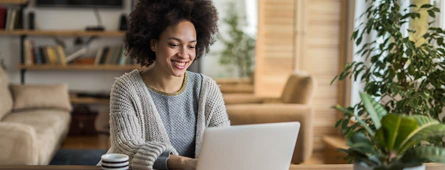 An online instructor teaching with empathy on their laptop.