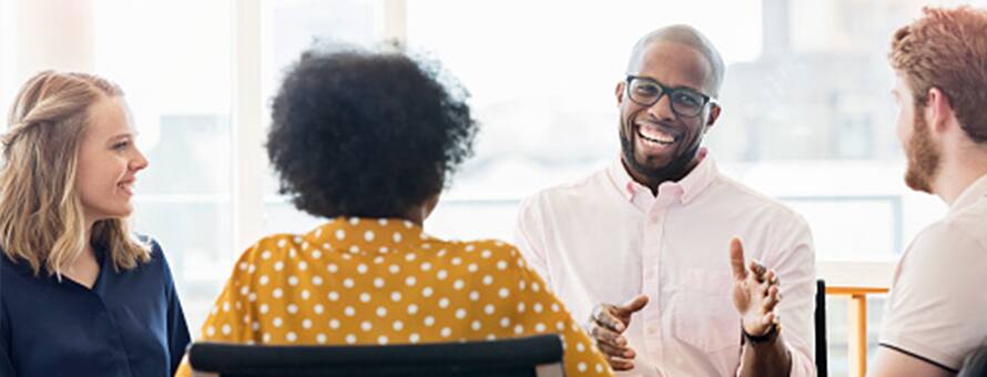 Three members of a marketing team discussing a campaign.