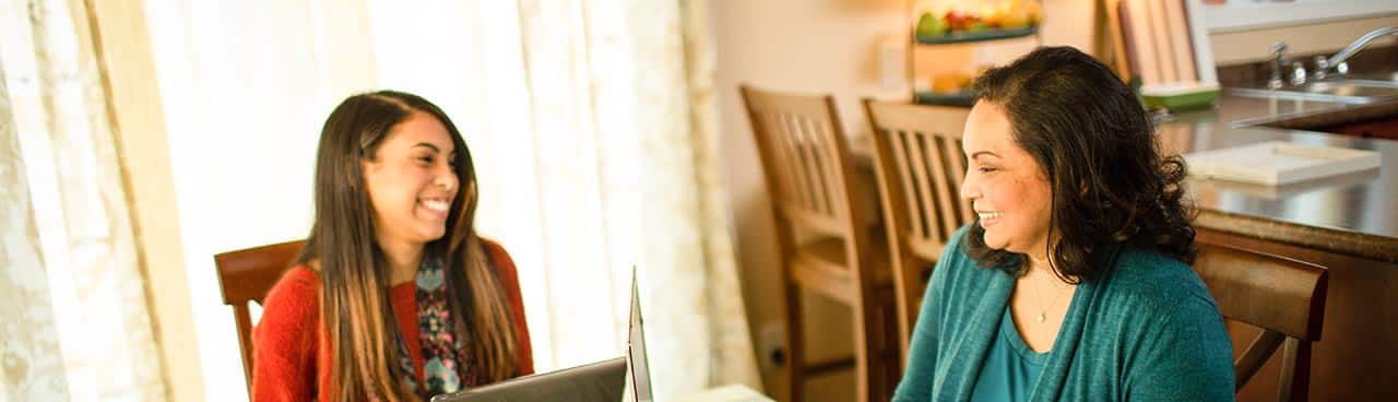Mother and daughter working on assignments together