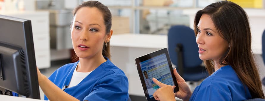 Two professionals discussing what health information management is