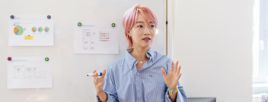 A person standing in front of a whiteboard explaining what political science is all about