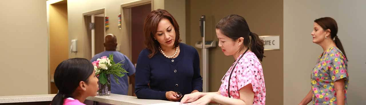 Two medical professionals having a discussion in a hospital environment