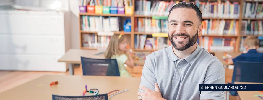 Student sitting in library with text Stephen Goulakos '22
