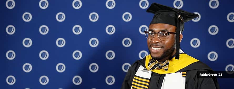 Rakia Green, in cap and gown, at SNHU''s commencement ceremony after earning his master's in healthcare degree online.