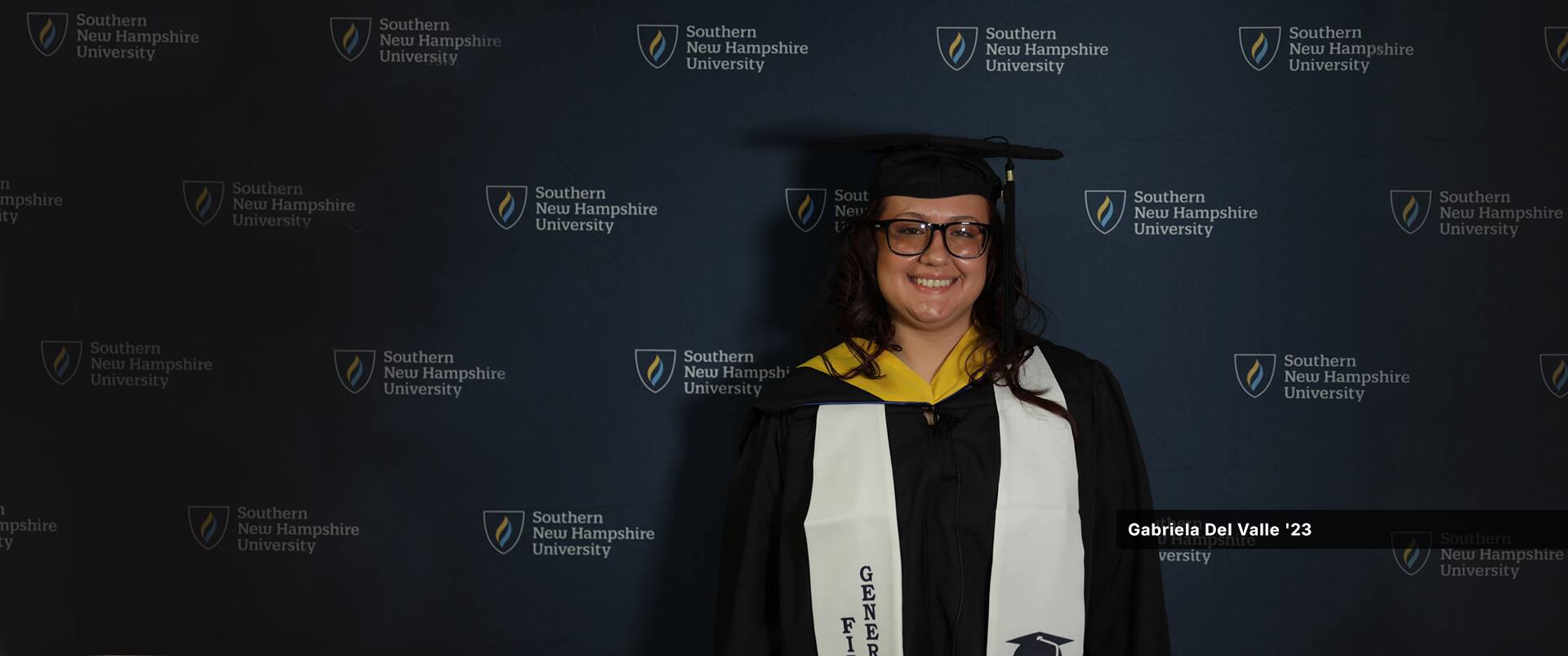 Gabriela Del Valle, who earned her bachelor's in psychology with a concentration in forensic psychology from SNHU in 2023, wearing her cap and gown.