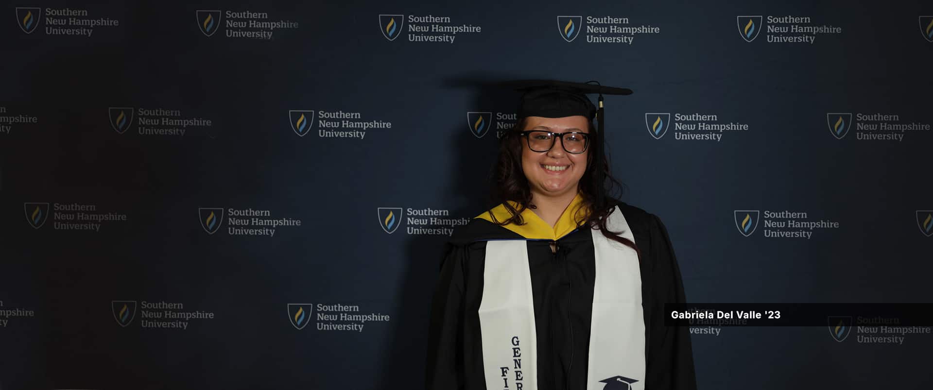 Gabriela Del Valle, who earned her bachelor's in psychology with a concentration in forensic psychology from SNHU in 2023, wearing her cap and gown.