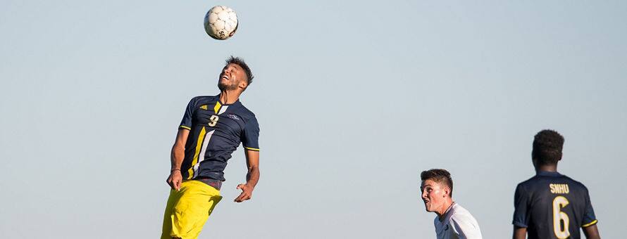 A student-athlete playing soccer