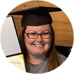 Laura Gaughan wearing a graduation cap and holding her SNHU diploma.
