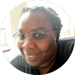 A headshot of Patrice Pilgrim-Wright smiling.