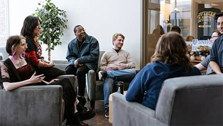 A groups of students gathering for a club meeting