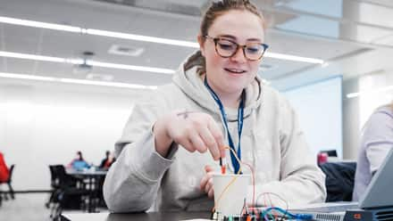 An SNHU student in the Engineering Lab