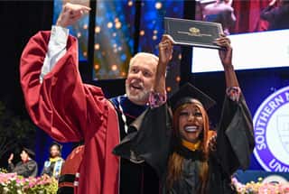 Paul LeBlanc with an SNHU grad at commencement