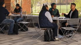 Students sitting at a patio